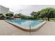 Inviting swimming pool with a surrounding deck at 7050 Sunset S Dr # 405, South Pasadena, FL 33707