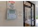 Secure building entry with telephone and security camera system at 7050 Sunset S Dr # 405, South Pasadena, FL 33707