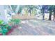 Spacious side yard with landscaping and wooden fence at 915 E Holland Ave, Tampa, FL 33612