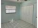 Bedroom with double-door closet and light blue walls at 10170 64Th Ave, Seminole, FL 33772