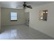 Open living area features tile flooring, natural light, and an open doorway to the kitchen at 10170 64Th Ave, Seminole, FL 33772