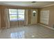 Living room with tile floors, built in shelving and neutral walls at 10170 64Th Ave, Seminole, FL 33772