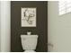 Clean bathroom with toilet and a dark accent wall at 10876 Ibis Brook Ct, Land O Lakes, FL 34638