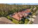 Home's tile roof and pool are visible from above in this neighborhood view at 12004 Marblehead Dr, Tampa, FL 33626