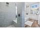 Spa-like bathroom with a walk-in shower, tiled walls, and a built-in bench at 12004 Marblehead Dr, Tampa, FL 33626