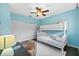 Bedroom with bunk bed, desk, and ceiling fan at 12004 Marblehead Dr, Tampa, FL 33626