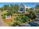 An inviting exterior view of the Ardea Country Club clubhouse, showcasing its manicured landscaping and architectural design at 122 E Cypress Ct # 22, Oldsmar, FL 34677