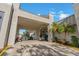 Covered entryway offering convenient access and parking, enhancing the arrival experience to the clubhouse at 122 E Cypress Ct # 22, Oldsmar, FL 34677
