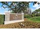 Ardea Country Club entrance sign surrounded by lush landscaping and flowers creating a welcoming atmosphere at 122 E Cypress Ct # 22, Oldsmar, FL 34677