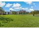 Low-rise condo buildings with lush landscaping and green space for residents to enjoy at 122 E Cypress Ct # 22, Oldsmar, FL 34677