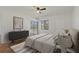 Light and airy main bedroom featuring tile floors, ceiling fan and sliding glass door at 122 E Cypress Ct # 22, Oldsmar, FL 34677