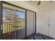 A view from the patio through sliding glass doors onto the manicured lawn at 122 E Cypress Ct # 22, Oldsmar, FL 34677