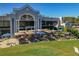 Golf club patio area with tables and chairs with umbrellas at 122 E Cypress Ct # 22, Oldsmar, FL 34677