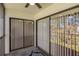 Balcony featuring sliding glass doors with verticals offering views of a manicured lawn at 122 E Cypress Ct # 22, Oldsmar, FL 34677