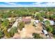 Aerial view of property showing house, detached buildings and large yard at 12494 Moon Rd, Brooksville, FL 34613