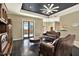 Living Room with hardwood floors, leather sofas, and a ceiling fan at 12494 Moon Rd, Brooksville, FL 34613