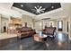 Living area with dark hardwood floors, leather sofas and a wood coffee table at 12494 Moon Rd, Brooksville, FL 34613