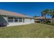 Private backyard with grassy area and patio at 1257 Corinth Greens Dr # 1257, Sun City Center, FL 33573
