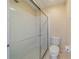 Clean bathroom with a shower and toilet at 1257 Corinth Greens Dr # 1257, Sun City Center, FL 33573