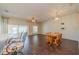 Spacious dining area with dark wood flooring and access to the kitchen and sunroom at 1257 Corinth Greens Dr # 1257, Sun City Center, FL 33573