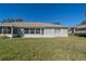 House back exterior view with lawn at 1257 Corinth Greens Dr # 1257, Sun City Center, FL 33573