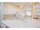 Well-lit kitchen featuring white cabinetry and ample counter space at 1257 Corinth Greens Dr # 1257, Sun City Center, FL 33573