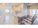 Kitchen with white cabinets, breakfast bar, and a built-in window seat at 1257 Corinth Greens Dr # 1257, Sun City Center, FL 33573