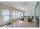 Relaxing sunroom with tiled floor and seating at 1257 Corinth Greens Dr # 1257, Sun City Center, FL 33573