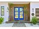 Stunning blue double front doors with wood accents and flanking planters at 1308 W Plymouth St, Tampa, FL 33603