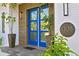 Modern blue front doors, wood siding, and potted plants create curb appeal at 1308 W Plymouth St, Tampa, FL 33603