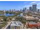 Aerial view of the property, showcasing its location near a lake and cityscape at 132 Mirror Lake N Dr # 404, St Petersburg, FL 33701