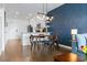 Dining area with mid-century modern chairs and a view into the kitchen at 132 Mirror Lake N Dr # 404, St Petersburg, FL 33701