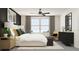 Bright bedroom with a king-size bed, dark accent wall, and stylish decor at 13693 Newbridge St, Spring Hill, FL 34609