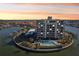 Aerial view of waterfront condo building with pool and parking at 1651 Sand Key Estates Ct # 44, Clearwater Beach, FL 33767