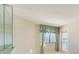 Bedroom with water view and built-in mirrored wall at 1651 Sand Key Estates Ct # 44, Clearwater Beach, FL 33767