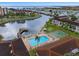 Aerial view of community, pool, and waterfront at 19029 Us Highway 19 N # 13F, Clearwater, FL 33764