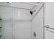 Shower with glass enclosure and tiled walls at 19029 Us Highway 19 N # 13F, Clearwater, FL 33764