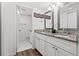 Double vanity bathroom with granite countertops at 19029 Us Highway 19 N # 13F, Clearwater, FL 33764