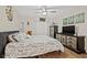 Spacious bedroom with king-size bed and large dresser at 19029 Us Highway 19 N # 13F, Clearwater, FL 33764