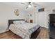 King-size bedroom with wood flooring and barn door at 19029 Us Highway 19 N # 13F, Clearwater, FL 33764