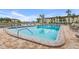 Inviting community pool with ample lounge chairs at 19029 Us Highway 19 N # 13F, Clearwater, FL 33764