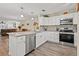 Modern kitchen with granite counters, stainless steel appliances, and an island at 19029 Us Highway 19 N # 13F, Clearwater, FL 33764