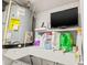 Laundry area with shelving for storage and a water heater at 19029 Us Highway 19 N # 13F, Clearwater, FL 33764