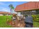 Outdoor patio with brick pavers and a covered grill at 19029 Us Highway 19 N # 13F, Clearwater, FL 33764