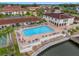 Community pool with ample deck space and waterfront access at 19029 Us Highway 19 N # 13F, Clearwater, FL 33764