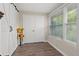 Bright sunroom featuring a farmhouse door and large windows at 19029 Us Highway 19 N # 13F, Clearwater, FL 33764