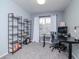 Home office with standing desk, shelving, and window at 2035 River Turia Cir, Riverview, FL 33578