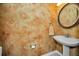 Small half bathroom with pedestal sink and decorative walls at 2182 Clover Hill Rd, Palm Harbor, FL 34683