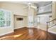 Bright living room with hardwood floors, high ceilings, and a loft area at 2182 Clover Hill Rd, Palm Harbor, FL 34683