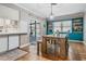 Dining area with built-in teal cabinets and view of pool at 2240 Colonial Dr, Dunedin, FL 34698
